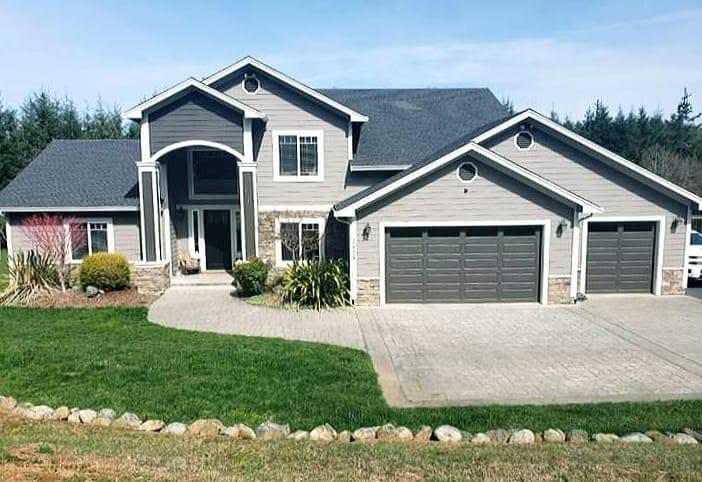 Finished large two-story residential exterior with stone accents