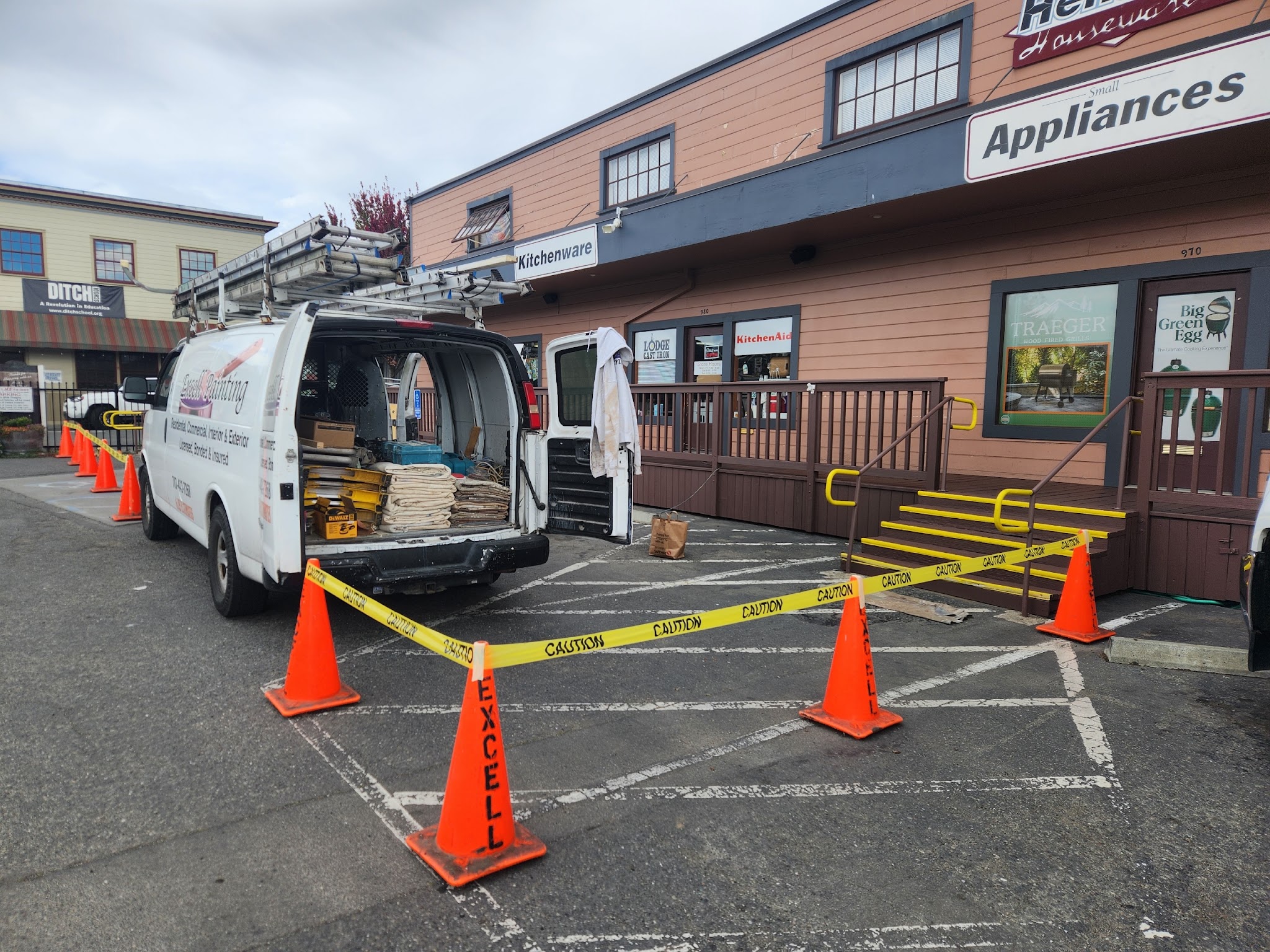 Excell Painting branded work van at a commercial jobsite in Eureka