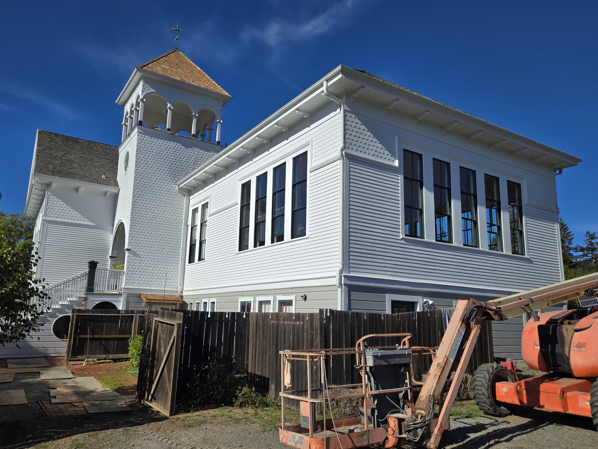 Finished historic building repaint by Excell Painting, crisp white exterior with detailed trim